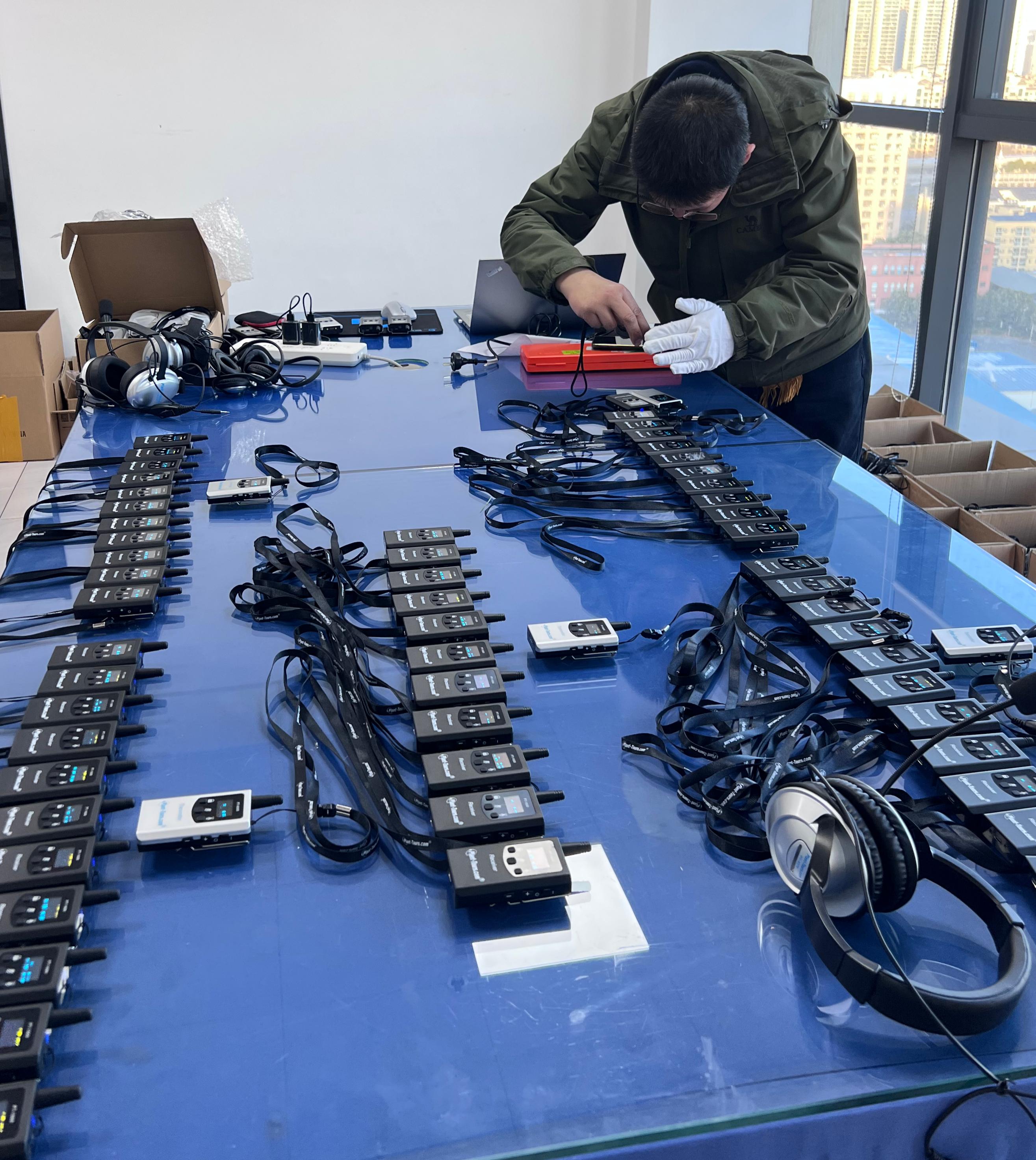 Testing tour guide audio equipment